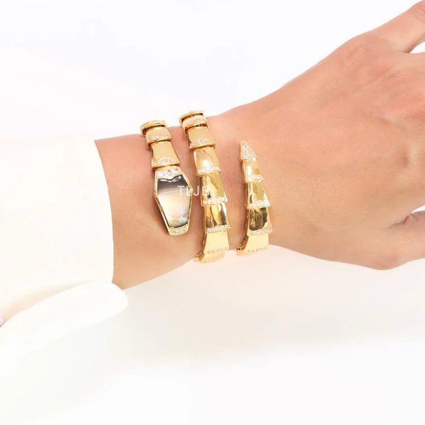 Bold gold and cz serpenti bracelet with black mop head
