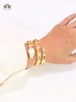 Bold gold and cz snake bracelet with white mop head