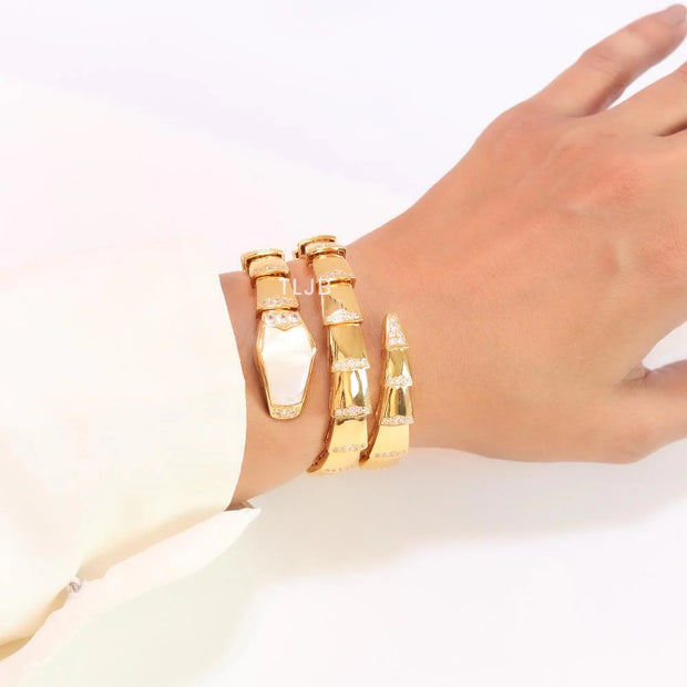 Bold gold and cz snake bracelet with white mop head