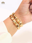 Bold gold and cz snake bracelet with white mop head