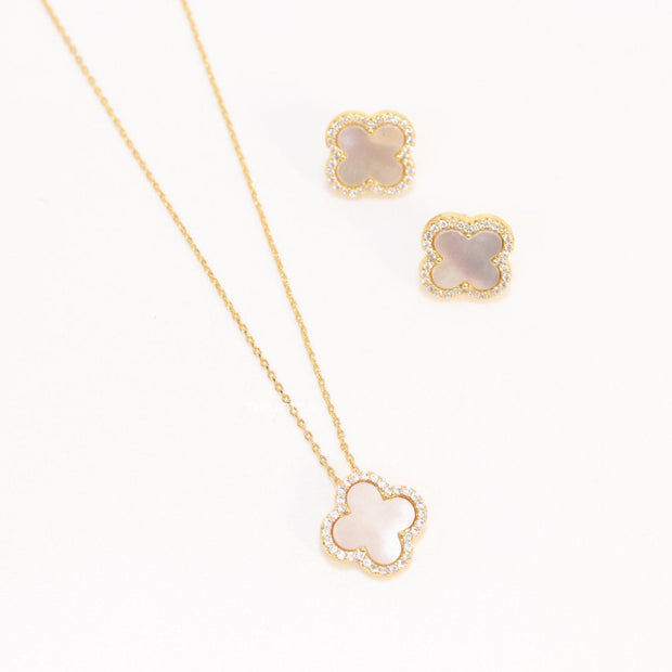 Sleek gold plated chain with cubic zirconia studded off-white clover shape pendant