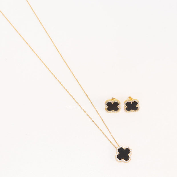 Sleek gold plated chain with cubic zirconia studded black clover shape pendant