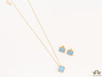 Sleek gold plated chain with cubic zirconia studded blue clover shape pendant