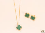 Sleek gold plated chain with cubic zirconia studded green clover shape pendant