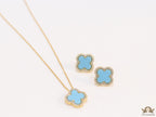 Sleek gold plated chain with cubic zirconia studded blue clover shape pendant