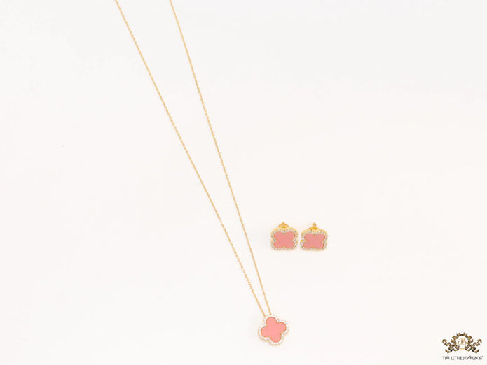 Sleek gold plated chain with cubic zirconia studded pink clover shape pendant