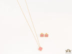 Sleek gold plated chain with cubic zirconia studded pink clover shape pendant