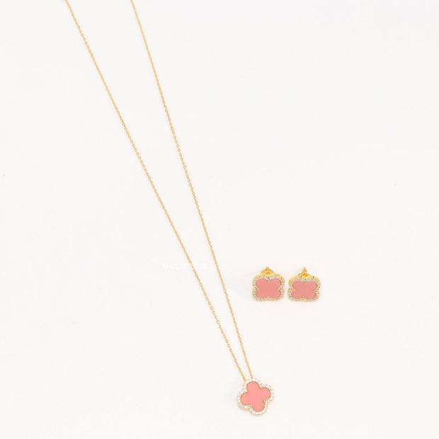 Sleek gold plated chain with cubic zirconia studded pink clover shape pendant