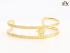Medusa on gold bracelet