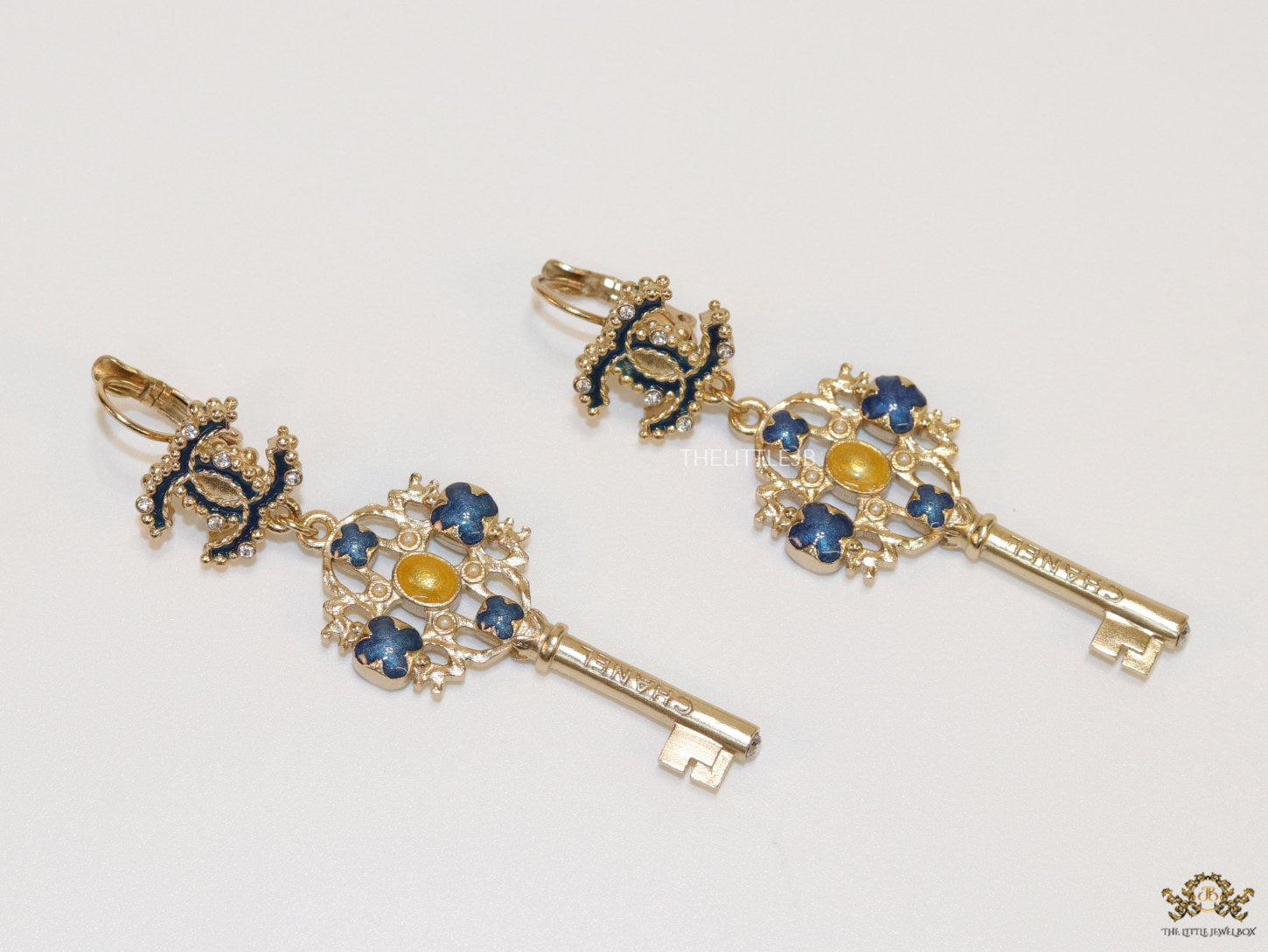 Gold plated key earrings with double C motif and clovers