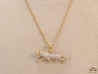 Gold plated cubic zirconia panther pendant on sleek gold plated chain