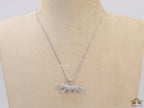 Platinum plated cubic zirconia panther pendant on sleek Platinum plated chain