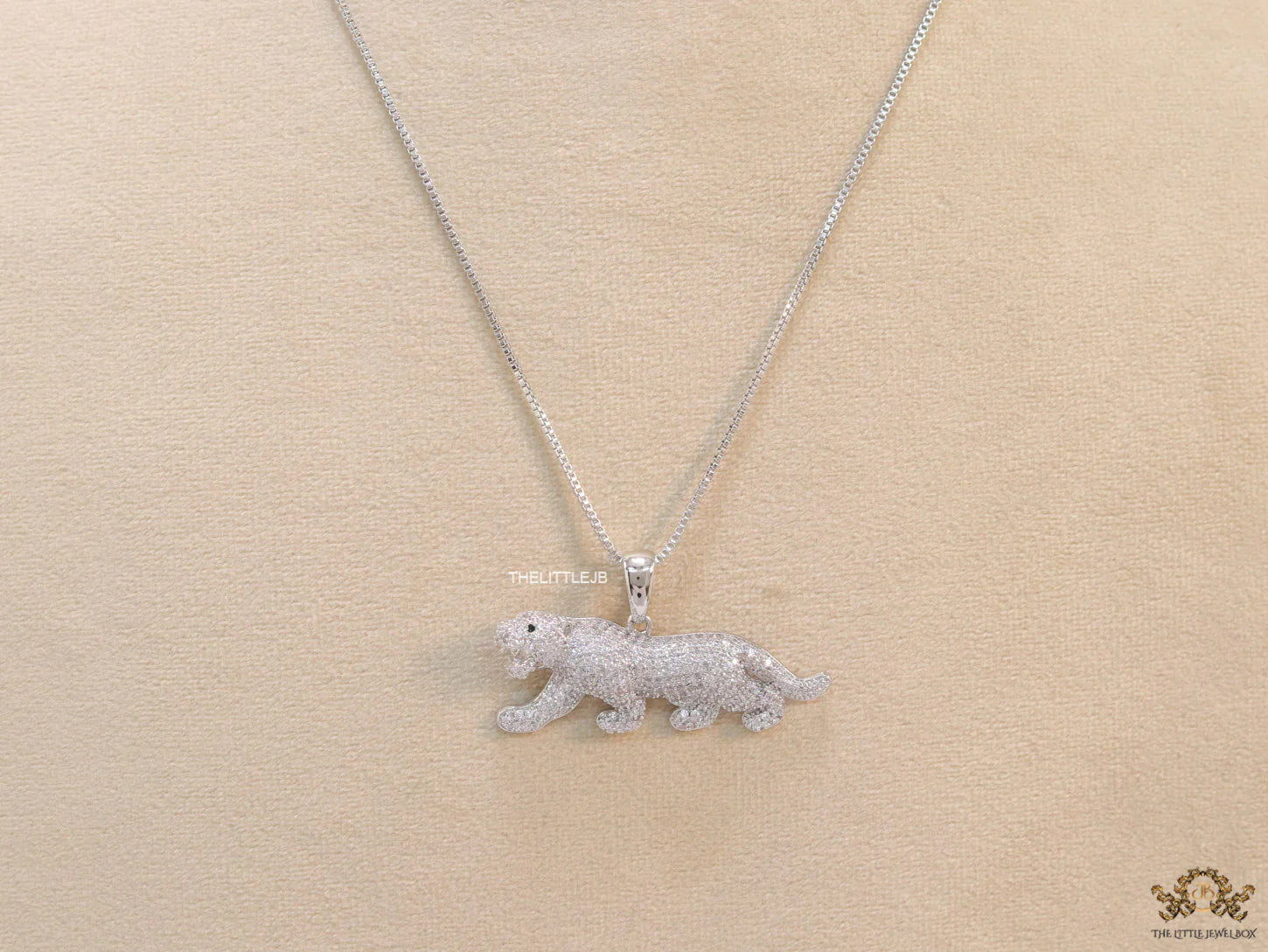 Platinum plated cubic zirconia panther pendant on sleek Platinum plated chain