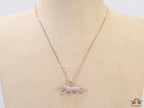 Rose Gold plated cubic zirconia panther pendant on sleek platinum plated chain