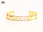 Double F on gold bracelet with cz