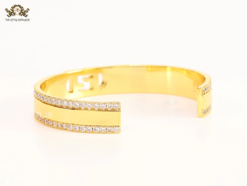 Double F on gold bracelet with cz