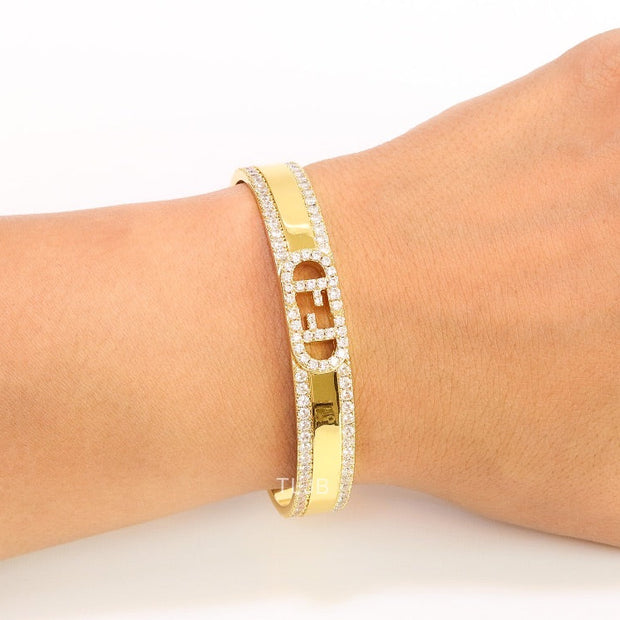 Double F on gold bracelet with cz