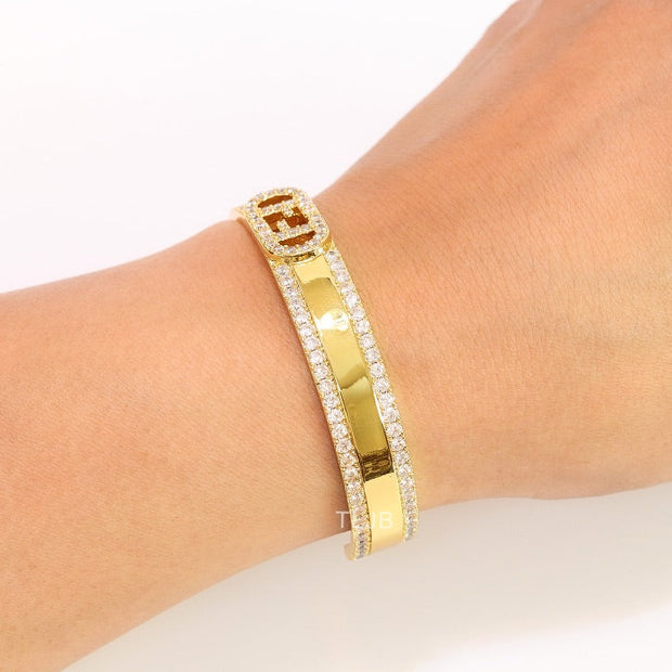 Double F on gold bracelet with cz