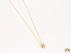 Gold plated cubic zirconia stones panther face motif pendant with emerald green stones details on sleek gold plated chain