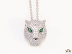 Platinum plated cubic zirconia stones panther face motif pendant with emerald green stones details on sleek Platinum plated chain
