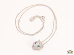 Platinum plated cubic zirconia stones panther face motif pendant with emerald green stones details on sleek Platinum plated chain