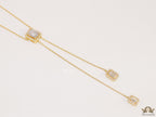 Emerald cut cubic zirconia stones in different sized on sleek gold plated chain