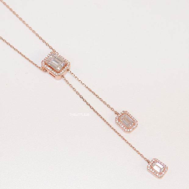 Emerald cut cubic zirconia stones in different sized on sleek rose gold plated chain
