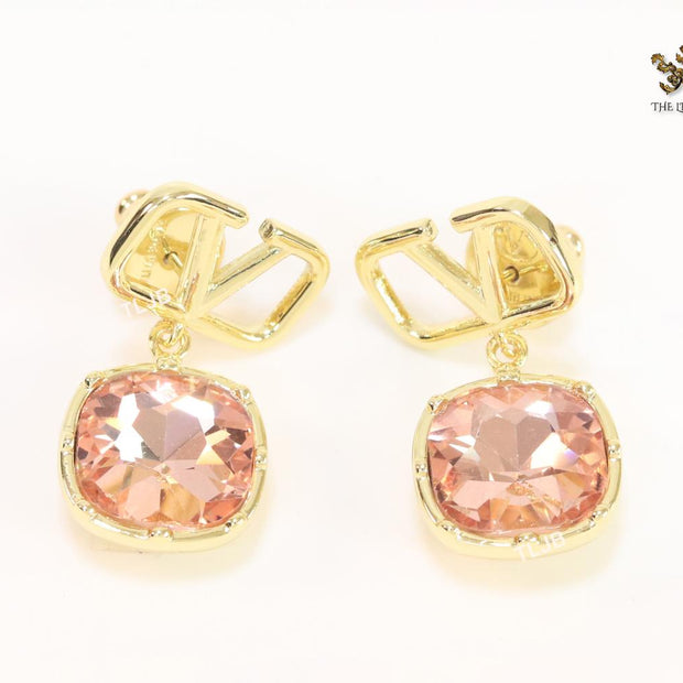 Alphabet open V dangles with pink stone