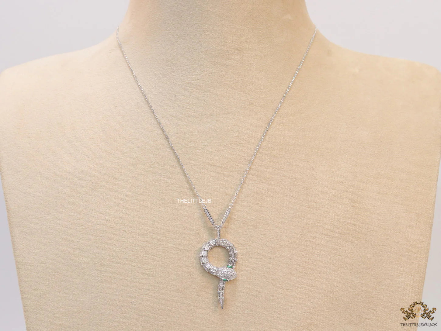 Sleek Platinum plated chain with Platinum plated cubic zirconia ancient serpentine symbol pendant