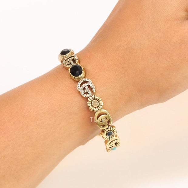 Double G cz with black stone open gold bracelet