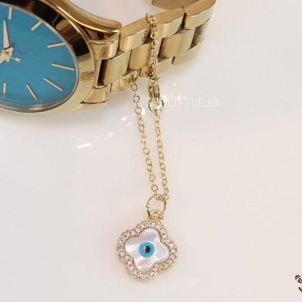 Gold plated cz evil eye clover watch charm with mother of pearl element