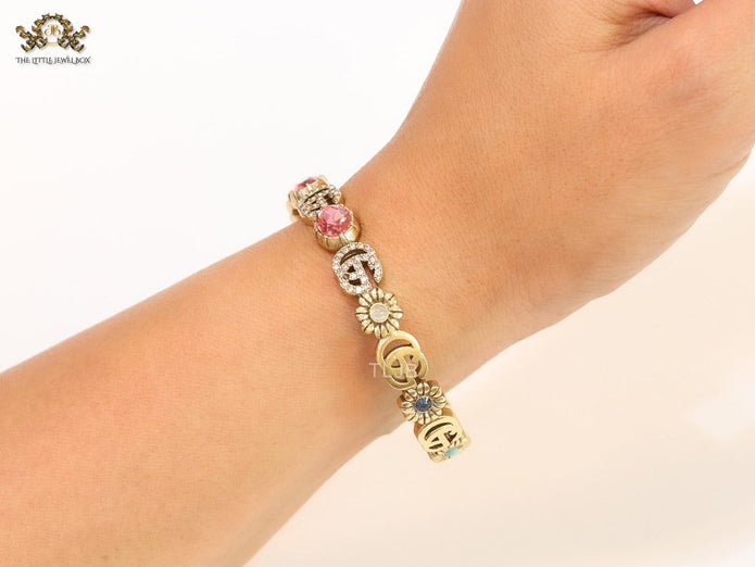 Double G cz with pink stone open gold bracelet