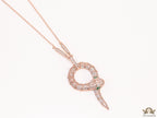 Sleek rose gold plated chain with gold plated cubic zirconia ancient serpentine symbol pendant