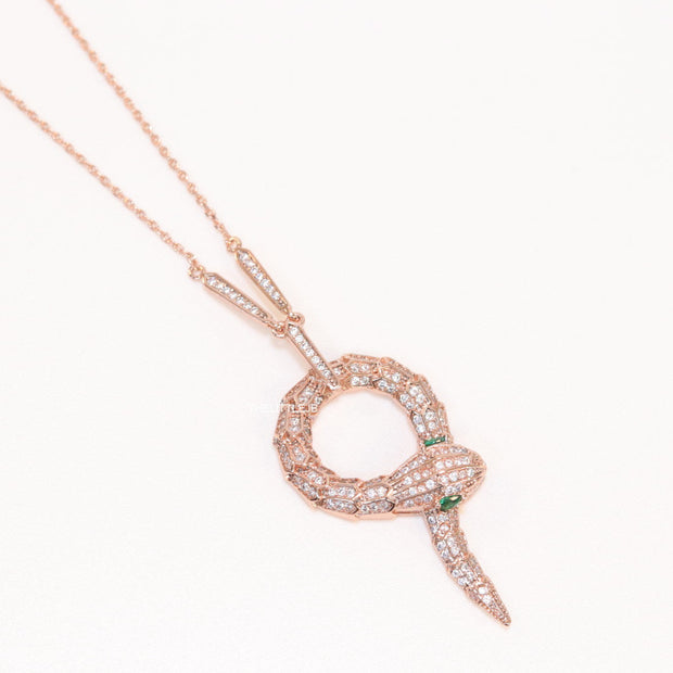 Sleek rose gold plated chain with gold plated cubic zirconia ancient serpentine symbol pendant