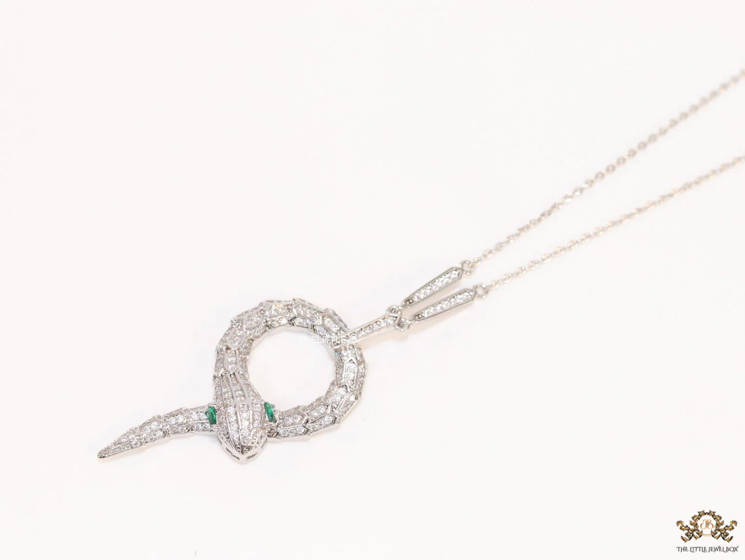 Sleek Platinum plated chain with Platinum plated cubic zirconia ancient serpentine symbol pendant