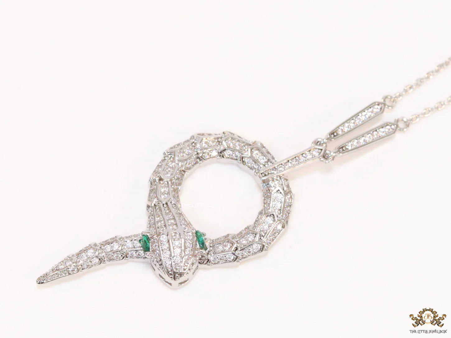 Sleek Platinum plated chain with Platinum plated cubic zirconia ancient serpentine symbol pendant