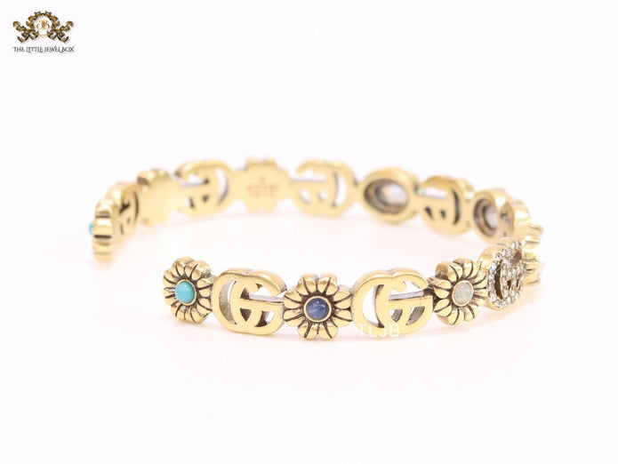 Double G cz with stone open gold bracelet