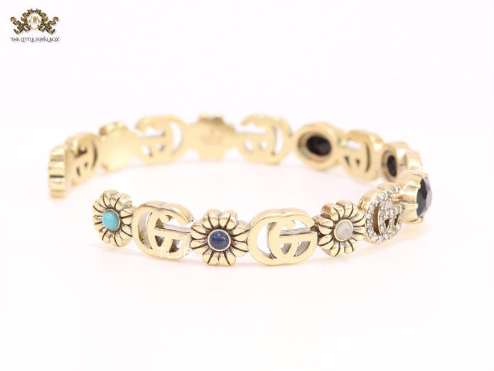 Double G cz with black stone open gold bracelet