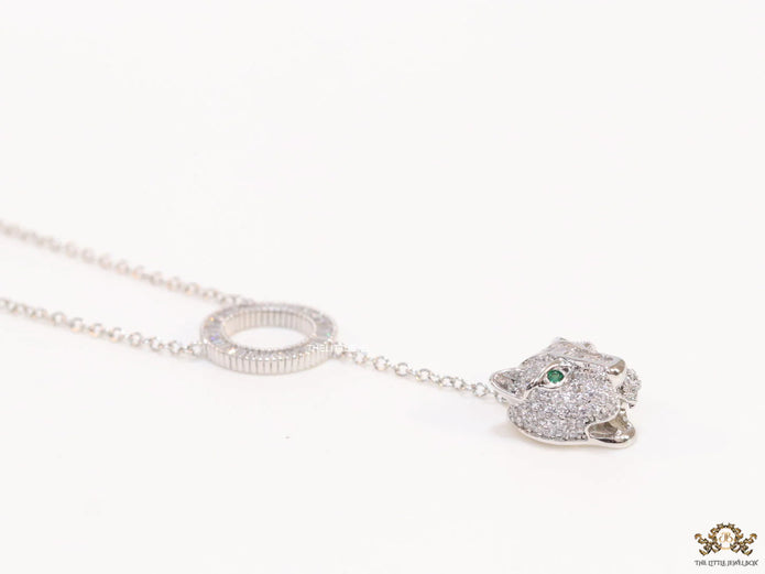 Platinum plated sleek chain with circular cubic zirconia disk and Platinum plated panther face motif pendant