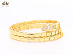 Gold triple layered serpentine bracelet with cz