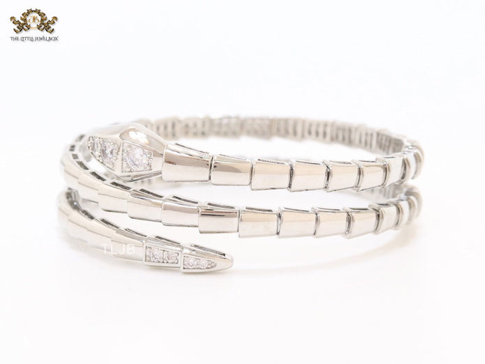 Platinum triple layered serpentine bracelet with cz