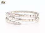 Platinum triple layered serpentine bracelet with cz