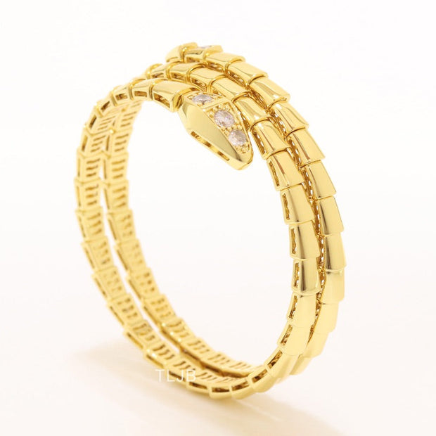 Gold triple layered snake bracelet with cz