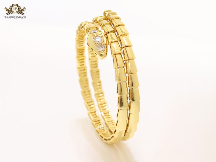 Gold triple layered serpentine bracelet with cz