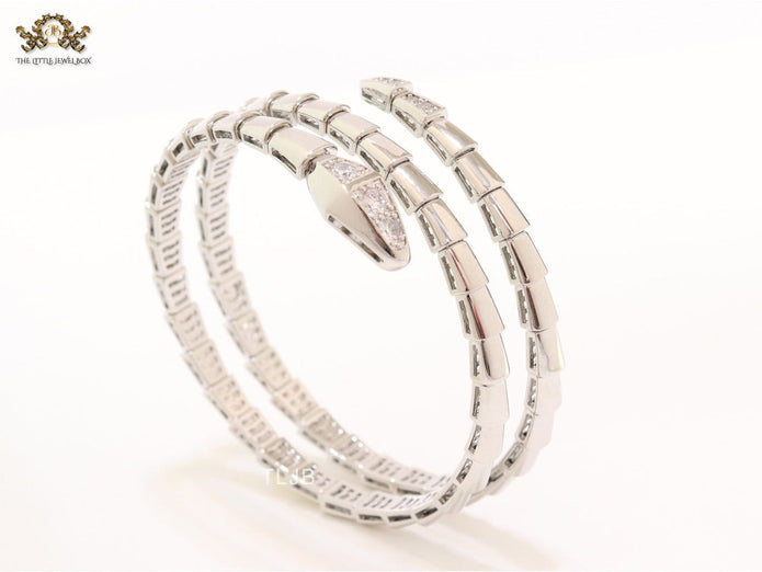 Platinum triple layered serpentine bracelet with cz