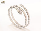 Platinum triple layered serpentine bracelet with cz