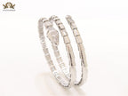 Platinum triple layered serpentine bracelet with cz