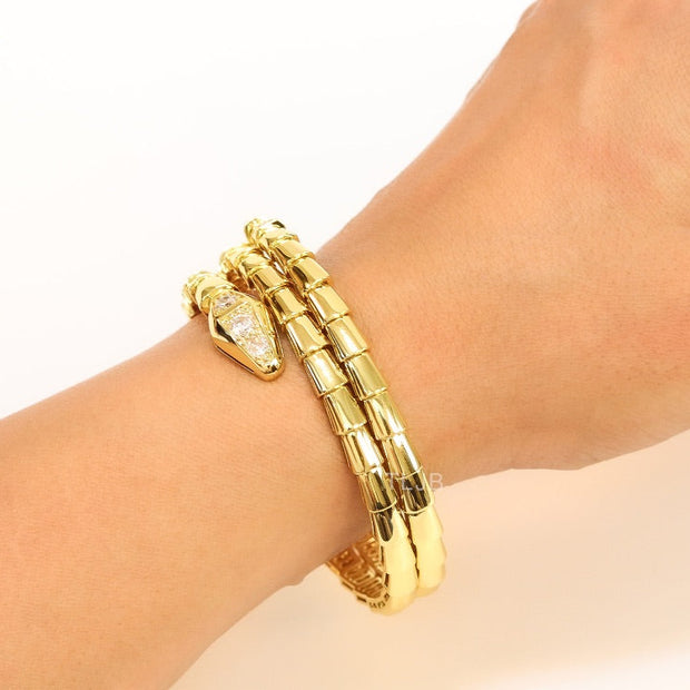 Gold triple layered serpentine bracelet with cz