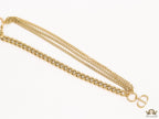Multiple golden chain necklace with alphabet pendant