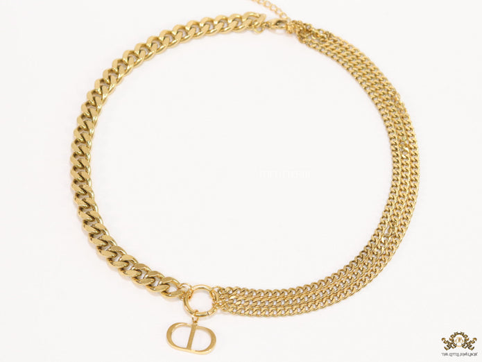 Multiple golden chain necklace with alphabet pendant
